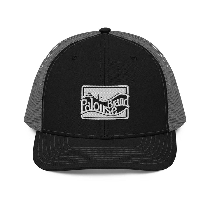 a black and gray trucker hat with a white logo